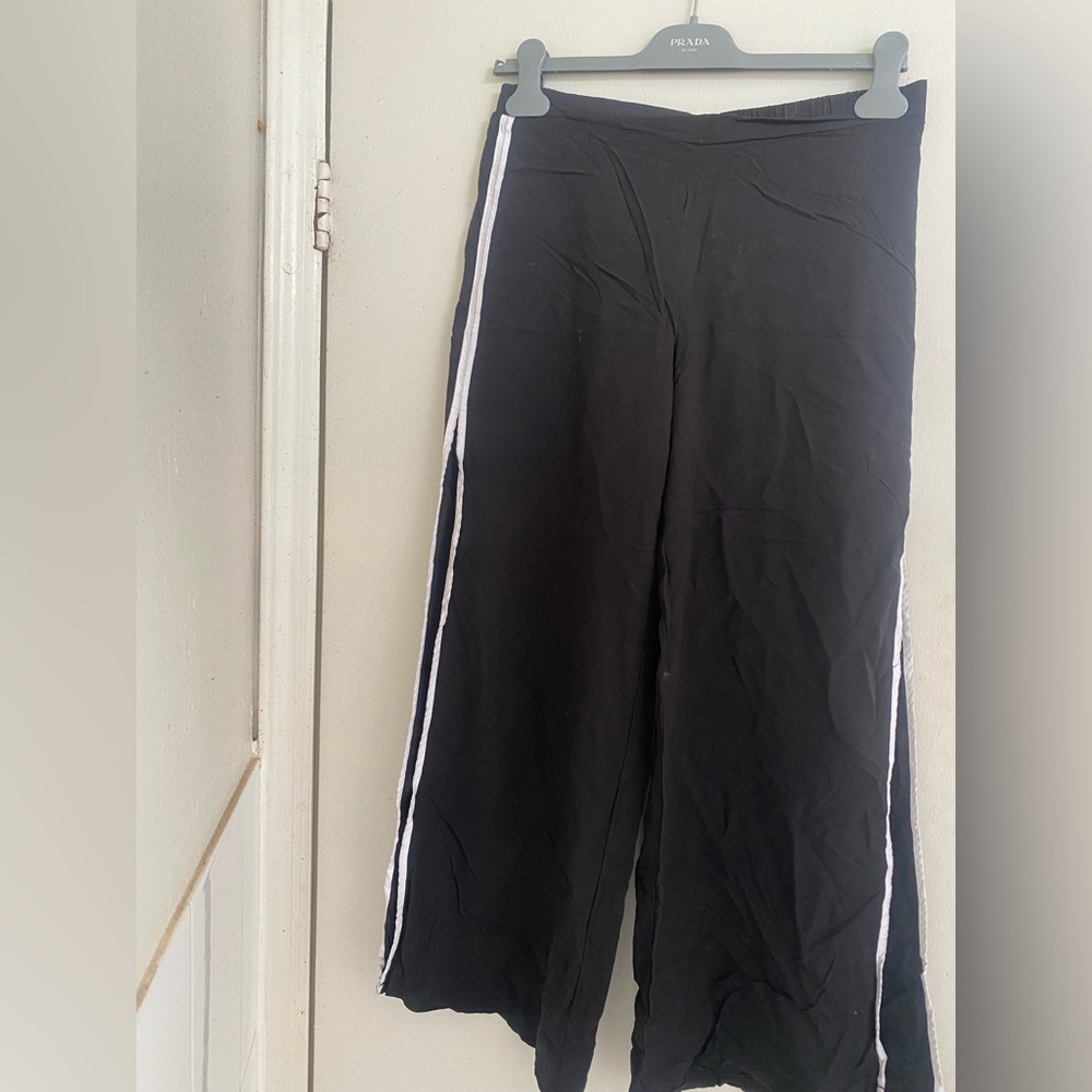 Trouser with slit on the size .